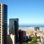 Barcelona business district skyline showing modern office buildings and Mediterranean coastline